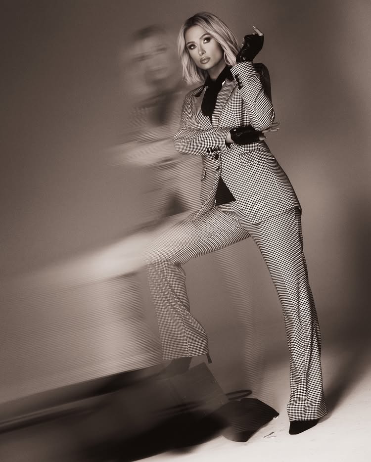Instagram post by @parishilton: Suited up on set with @KitButlerr for @KarlLagerfeld ⭐️🖤✨📸 #IKONIK 💫 #ThatsHot 🔥